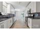 Updated kitchen featuring stainless steel appliances and shaker style white cabinets at 3807 Sweetgrass Ln, Charlotte, NC 28226