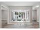 Bright living room featuring a large window view of the outdoor lounge area at 3807 Sweetgrass Ln, Charlotte, NC 28226