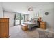 Spacious main bedroom featuring a sliding door out to the backyard and neutral colors at 3807 Sweetgrass Ln, Charlotte, NC 28226