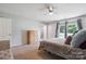 Main bedroom with ceiling fan, neutral decor and direct access to an outdoor area at 3807 Sweetgrass Ln, Charlotte, NC 28226