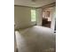 Bright bedroom featuring neutral carpet, a window and open doorway to the en-suite bathroom at 4006 Hillview Dr, Shelby, NC 28152