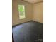 Simple bedroom featuring neutral walls and a window for natural light at 4006 Hillview Dr, Shelby, NC 28152