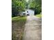 Exterior view of home featuring a concrete driveway and partially wooded lot at 4006 Hillview Dr, Shelby, NC 28152