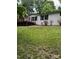 Exterior view of home featuring a wooden deck with lush green lawn and trees at 4006 Hillview Dr, Shelby, NC 28152