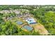 Community aerial featuring a pool, clubhouse, and tennis courts, with ample parking and winding walking paths at 417 Brier Knob Dr, Fort Mill, SC 29715