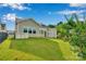 Beautifully landscaped backyard with lush lawn, a patio, and pergola for outdoor enjoyment at 417 Brier Knob Dr, Fort Mill, SC 29715