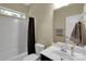Well-lit bathroom featuring a shower-tub combo, single vanity, and neutral-toned decor providing a fresh and clean space at 417 Brier Knob Dr, Fort Mill, SC 29715