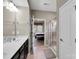 Bathroom with double sinks, a large mirror, and shower nearby at 417 Brier Knob Dr, Fort Mill, SC 29715