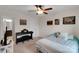 Cozy bedroom featuring a comfortable bed, ceiling fan, and ample wall decor at 417 Brier Knob Dr, Fort Mill, SC 29715