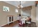 A dining room with dark wood floors, a chandelier, and a rustic table at 417 Brier Knob Dr, Fort Mill, SC 29715