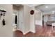 Inviting entryway with hardwood floors leads to a bathroom and living area, adorned with a personalized decor sign at 417 Brier Knob Dr, Fort Mill, SC 29715