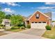 Charming, well-maintained brick home featuring a two-car garage and beautifully landscaped front yard, enhancing curb appeal at 417 Brier Knob Dr, Fort Mill, SC 29715