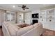 Bright living room featuring a fireplace with built-in shelves and access to the backyard at 417 Brier Knob Dr, Fort Mill, SC 29715