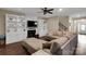 Cozy living room features a fireplace with built-in shelving, a ceiling fan, and comfortable seating at 417 Brier Knob Dr, Fort Mill, SC 29715