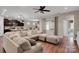 Cozy living room featuring an open layout to the kitchen, with comfortable seating and hardwood floors throughout at 417 Brier Knob Dr, Fort Mill, SC 29715