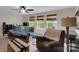 Inviting living room with a ceiling fan, large windows, and plush seating at 417 Brier Knob Dr, Fort Mill, SC 29715