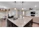 An open floor plan features a kitchen, dining area, and living room with a fireplace at 417 Brier Knob Dr, Fort Mill, SC 29715