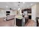 An open floor plan features a kitchen, living room with a fireplace and staircase at 417 Brier Knob Dr, Fort Mill, SC 29715