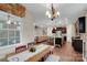An open floor plan features a dining area, kitchen and living room with a staircase at 417 Brier Knob Dr, Fort Mill, SC 29715