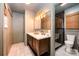 Bathroom with double sink, a modern vanity, and a shower with tile surround at 418 Melody Ln, Shelby, NC 28152