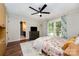 Comfortable bedroom with an en-suite bathroom, dresser, and floral-patterned bedding and decorative rug at 418 Melody Ln, Shelby, NC 28152