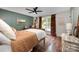 Cozy bedroom with hardwood floors, decorative rug, and a large window with patterned curtains at 418 Melody Ln, Shelby, NC 28152