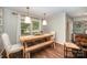 Cozy dining area with a wooden table, pendant lighting, and large windows for natural light at 418 Melody Ln, Shelby, NC 28152