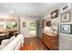 Inviting entryway featuring hardwood floors and charming decor, leading to a dining area at 418 Melody Ln, Shelby, NC 28152