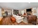 Spacious living room with a fireplace, built-in shelves, and hardwood floors at 418 Melody Ln, Shelby, NC 28152