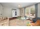 Spacious playroom featuring hardwood floors, a large window, and a chalk board dresser at 418 Melody Ln, Shelby, NC 28152