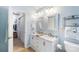 Bathroom featuring a double vanity, updated fixtures, and ample cabinet space at 4333 Poplar Grove Dr, Charlotte, NC 28269