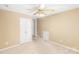 Neutral bedroom with a ceiling fan and a double doored closet at 4333 Poplar Grove Dr, Charlotte, NC 28269
