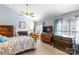 Bright bedroom with a fireplace, a ceiling fan, and traditional-style furnishings at 4333 Poplar Grove Dr, Charlotte, NC 28269
