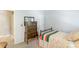 Bedroom with dresser, doorway, light blue walls, and patterned bedspread at 4333 Poplar Grove Dr, Charlotte, NC 28269