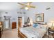 Spacious bedroom with a ceiling fan, an ensuite bathroom, and charming wood furnishings at 4333 Poplar Grove Dr, Charlotte, NC 28269