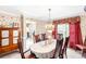 Dining room with natural light, floral wallpaper, and ornate chandelier lighting fixture at 4333 Poplar Grove Dr, Charlotte, NC 28269
