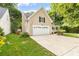 This home features an attached garage and long driveway at 4333 Poplar Grove Dr, Charlotte, NC 28269