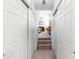 Hallway leading to a bedroom with a fireplace and a carpeted staircase to another level at 4333 Poplar Grove Dr, Charlotte, NC 28269