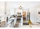 Bright kitchen features stainless appliances, white cabinets, granite counters, and natural light at 4333 Poplar Grove Dr, Charlotte, NC 28269