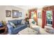 Living room with neutral walls, window views, and comfortable seating furniture at 4333 Poplar Grove Dr, Charlotte, NC 28269