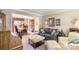 Living room with neutral walls, adjacent dining room, and comfortable seating furniture at 4333 Poplar Grove Dr, Charlotte, NC 28269