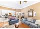 Open-concept living room with hardwood floors, neutral walls, and seamless flow to kitchen at 4333 Poplar Grove Dr, Charlotte, NC 28269