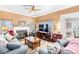 Cozy living room featuring a fireplace, ceiling fan, and comfortable seating at 4333 Poplar Grove Dr, Charlotte, NC 28269