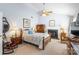 Spacious main bedroom with a fireplace, ceiling fan, and ample natural light at 4333 Poplar Grove Dr, Charlotte, NC 28269