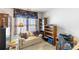 Office featuring a sofa, desk, bookcase, and window at 4333 Poplar Grove Dr, Charlotte, NC 28269