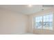 Bedroom with plush carpet, natural light from large windows, and neutral wall paint at 4404 Dusty Orchard Rd, Kannapolis, NC 28081