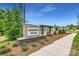 Summerlyn Village neighborhood entrance sign with stone base, landscaping, and walking path at 4415 Dusty Orchard Rd, Kannapolis, NC 28081