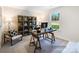 Inviting home office space with a large window, rustic desk and shelving for storage and decoration at 4415 Dusty Orchard Rd, Kannapolis, NC 28081