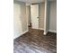 Small bedroom with neutral paint, wood look floors, and white doors and trim at 4417 Grier St, Gastonia, NC 28056