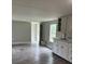 Open concept living area featuring new wood grain vinyl flooring and new paint at 4417 Grier St, Gastonia, NC 28056